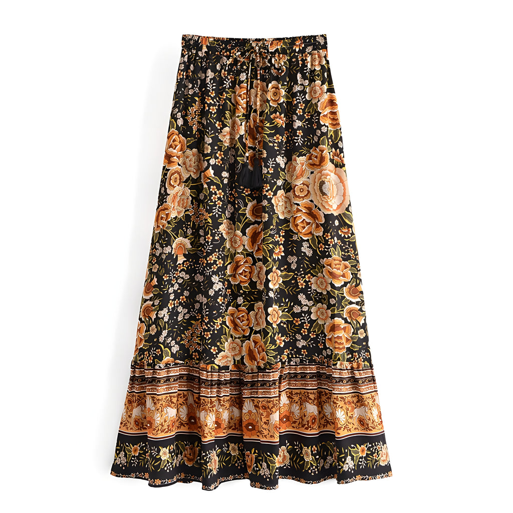 Jupe maxi bohème noire à grandes roses orange, bordure ethnique et taille smockée