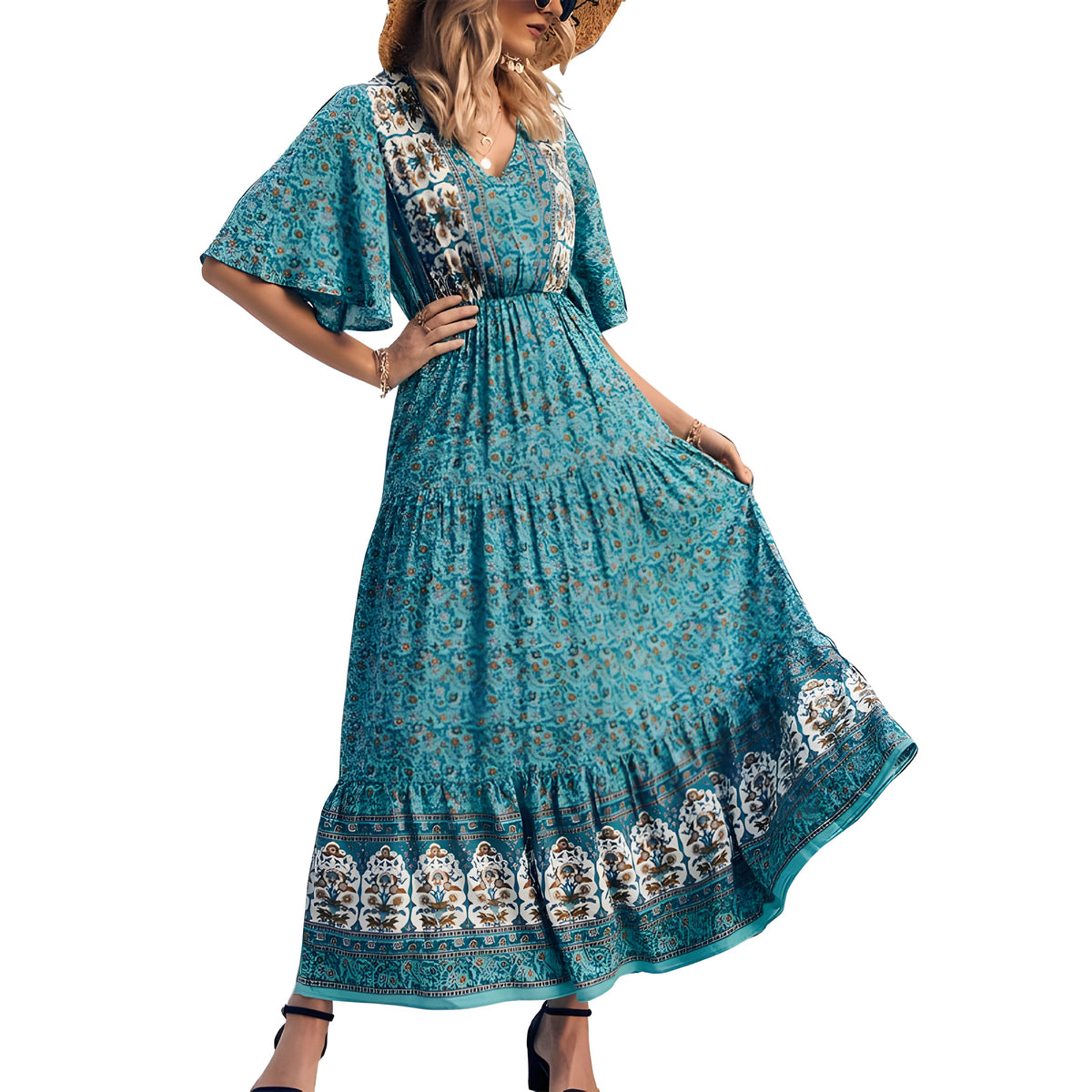 Robe longue bohème turquoise à fleurs portée, col V et manches évasées