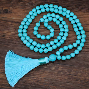 Collier sautoir mala perles turquoise avec pompon