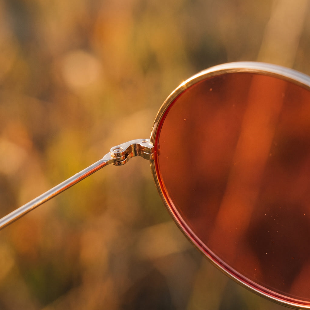 Lunettes de soleil rondes hippie monture dorée